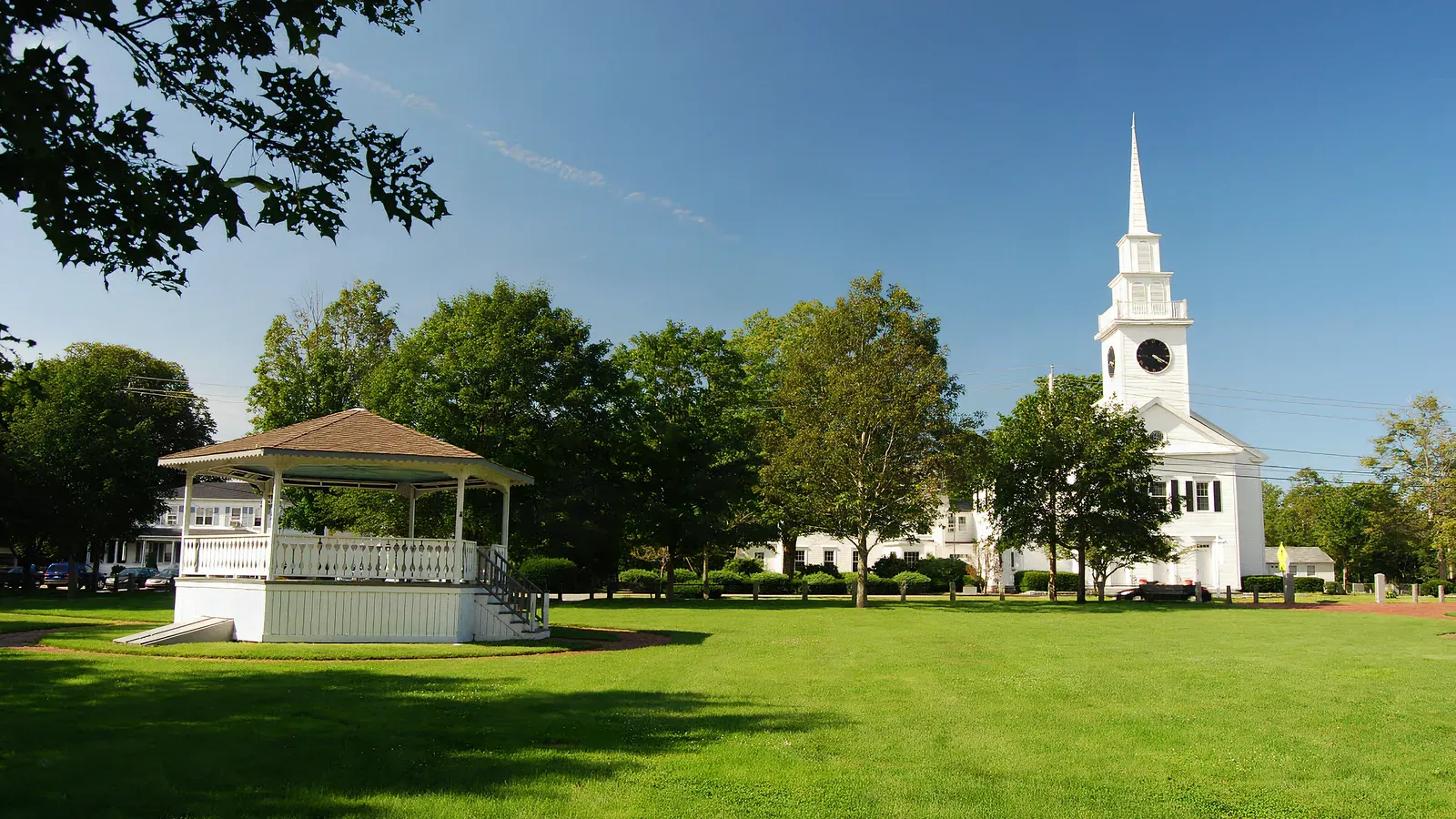 The East Bridgewater town common with its bandstand and a white-steepled meetinghouse beyond the lawn, East Bridgewater, Massachusetts