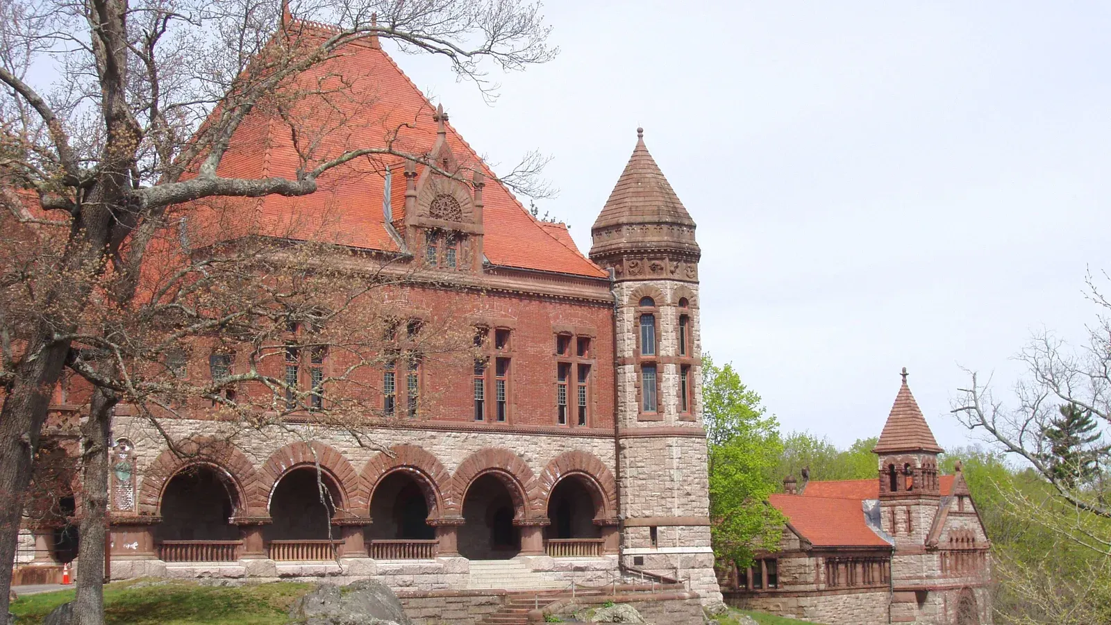 Oakes Ames Memorial Hall, a Richardsonian Romanesque brownstone hall with an arcaded loggia and conical tower, North Easton, Massachusetts
